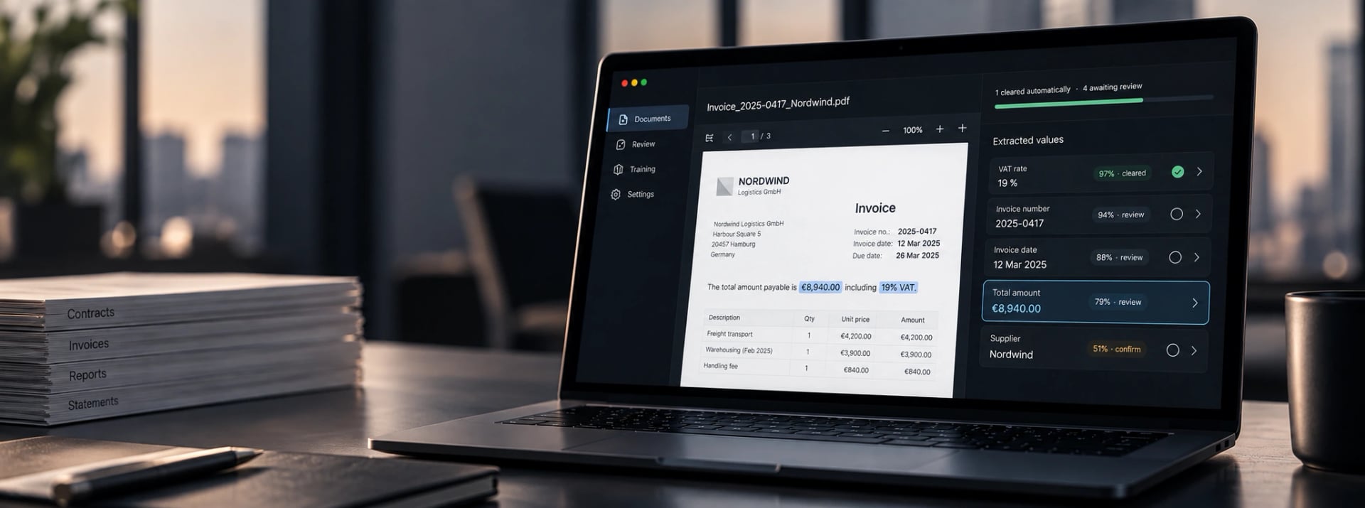The document review open on a laptop: an invoice beside the values extracted from it.